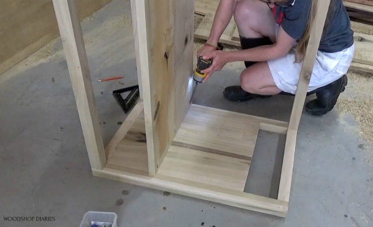 screwing open dresser shelf in place using pocket holes and screws