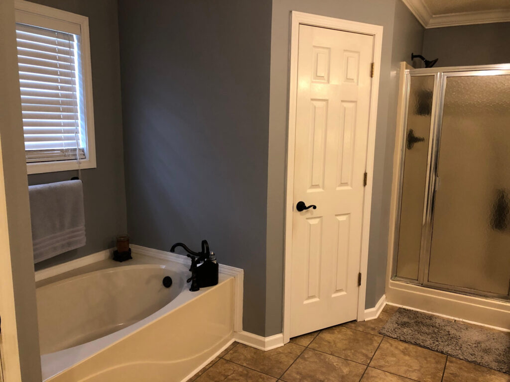 Master bathroom before--tub and closet