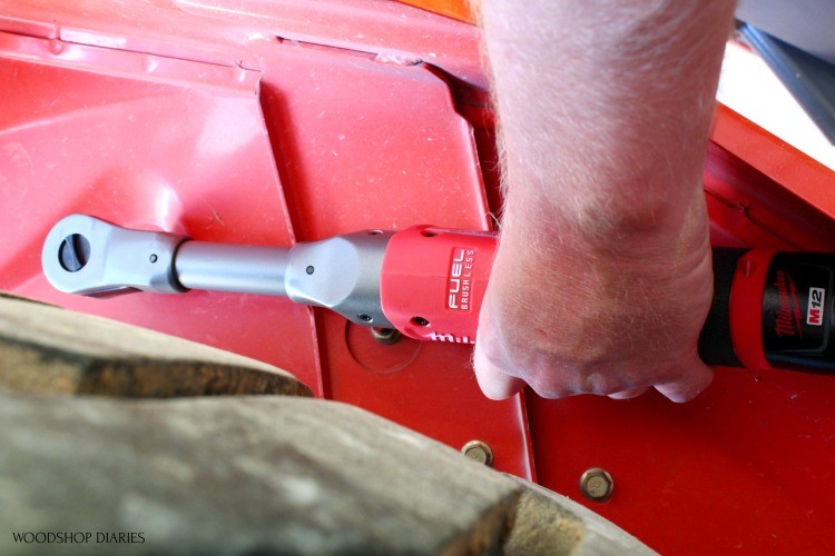 Using milwaukee ratchet to tighten bolt on tractor fender