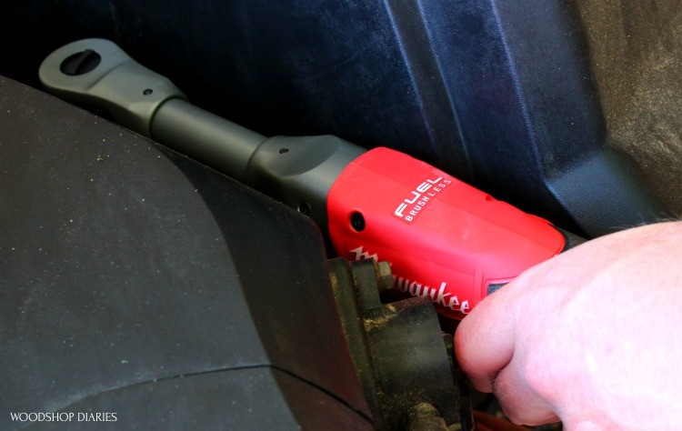 Using milwaukee ratchet in tight spot to tighten nut on lawnmower motor