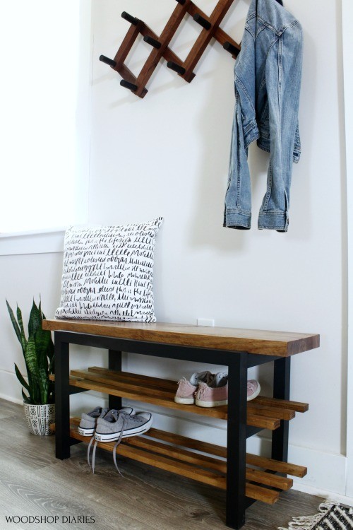 DIY shoe bench made from a single board staged in entryway