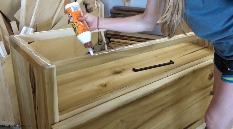 Apply wood glue  along dresser top