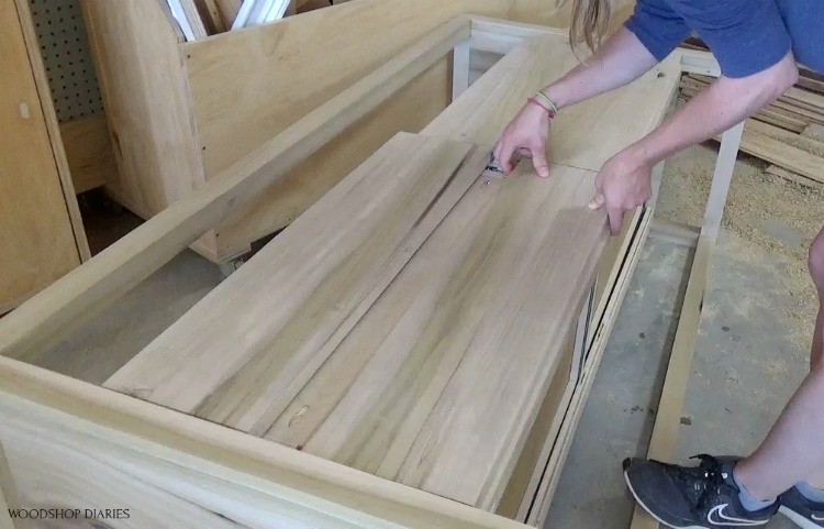 Laying out drawer fronts to check spacing on dresser drawers