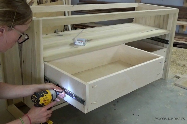 Shara installing drawer boxes into DIY modern dresser