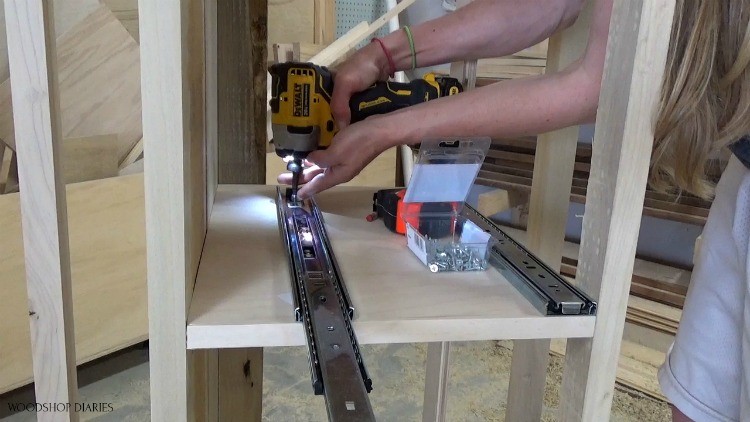 Shara installing drawer slides onto modern dresser