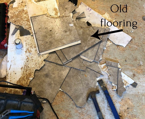 Pile of old linoleum flooring pulled off master bathroom floor