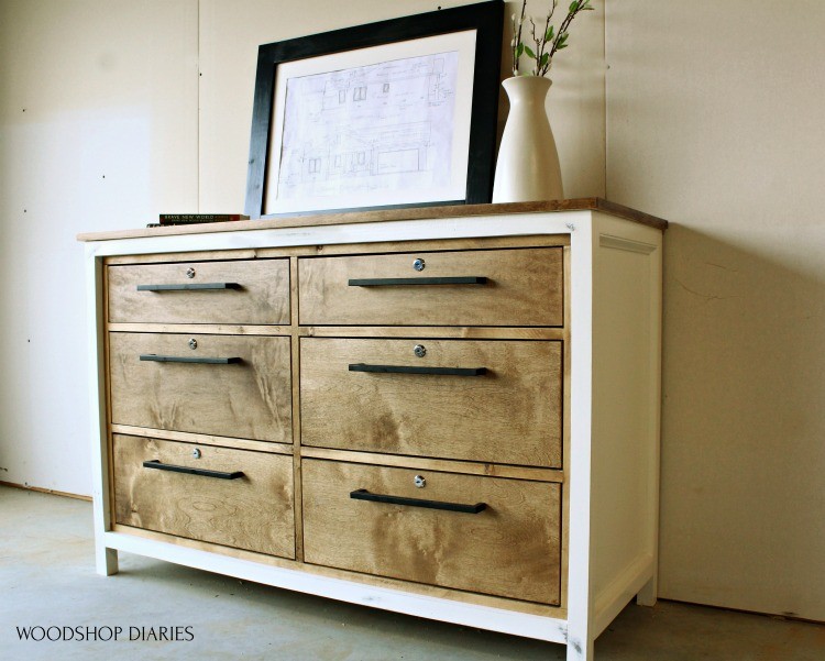 Simple two tone white and wood 6 drawer dresser with modern pulls and locks