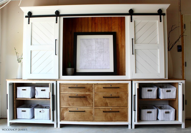 Large Entertainment center two bottom cabinets and a middle dresser with large sliding door top cabinet