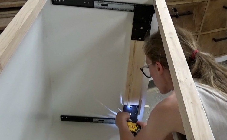 Installing scrap board between pocket door slides