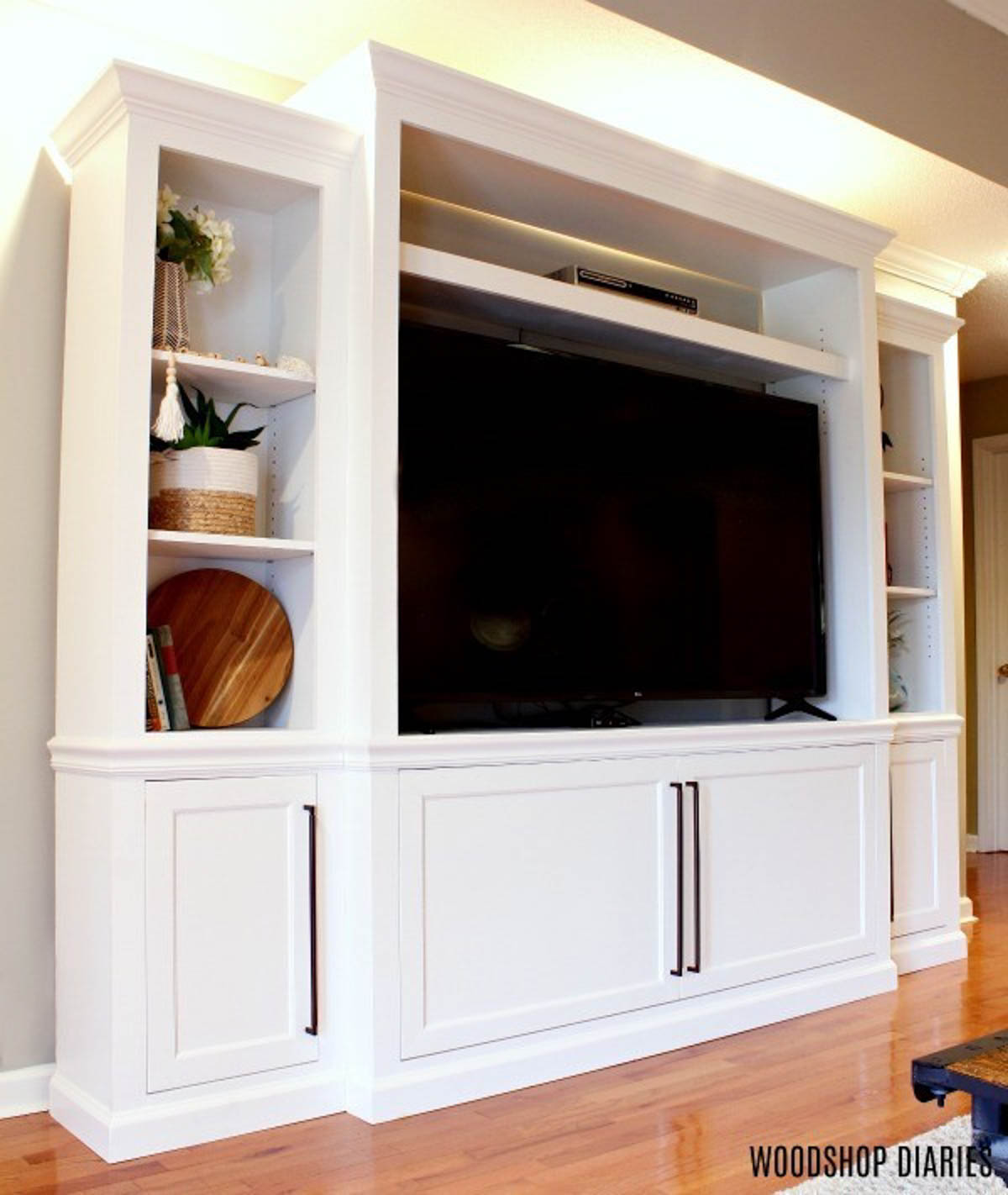 entertainment center painted white for a professional finish