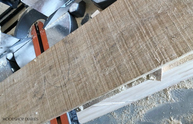rough sawn white oak board on miter saw