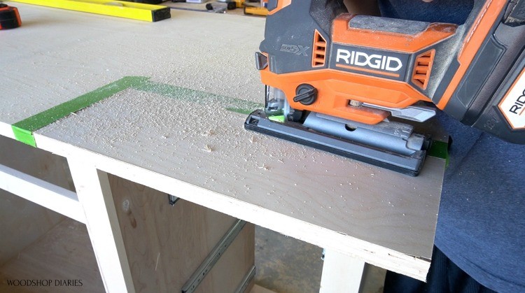 Using a jig saw to cut corners of top panel