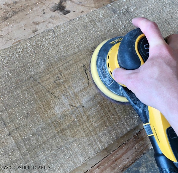 Using sander to sand rough sawn board