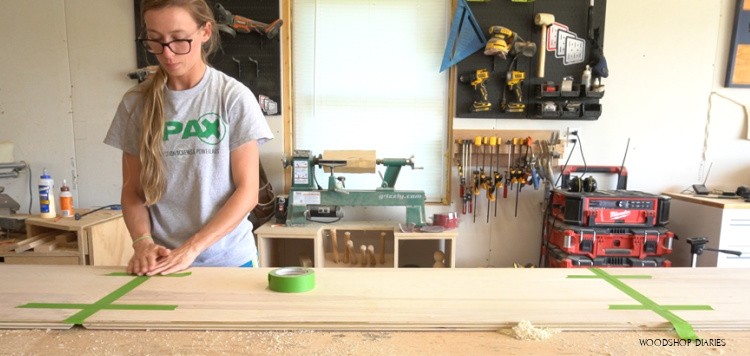 Applying painters tape to miter joints for desk glue up