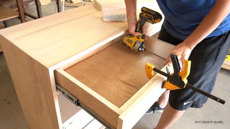 Screw drawer fronts into place from inside of drawers