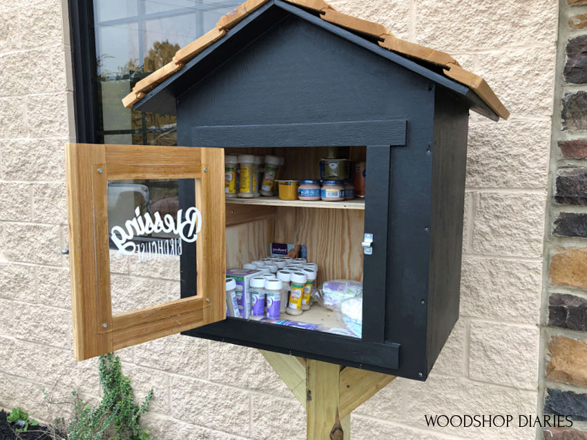 Blessing box black and cedar with door open showing stock inside