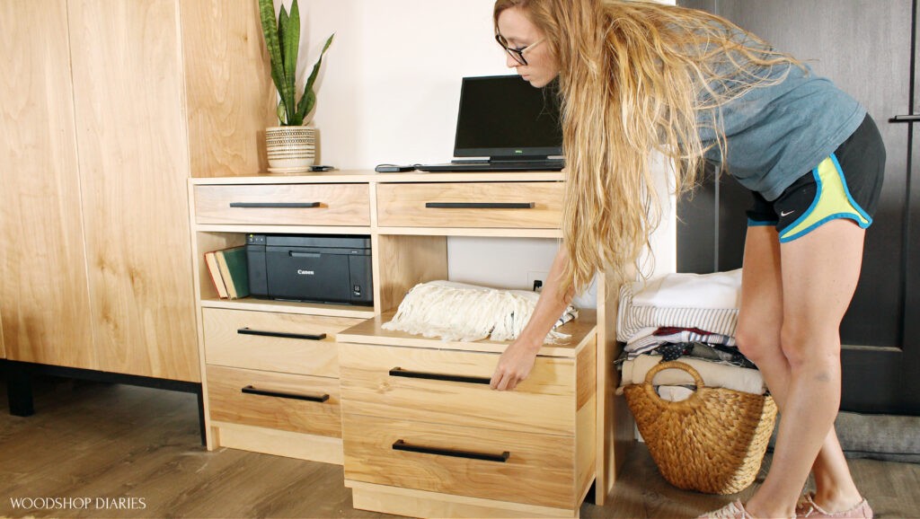 Shara Woodshop Diaries pulling storage cart seat out of desk