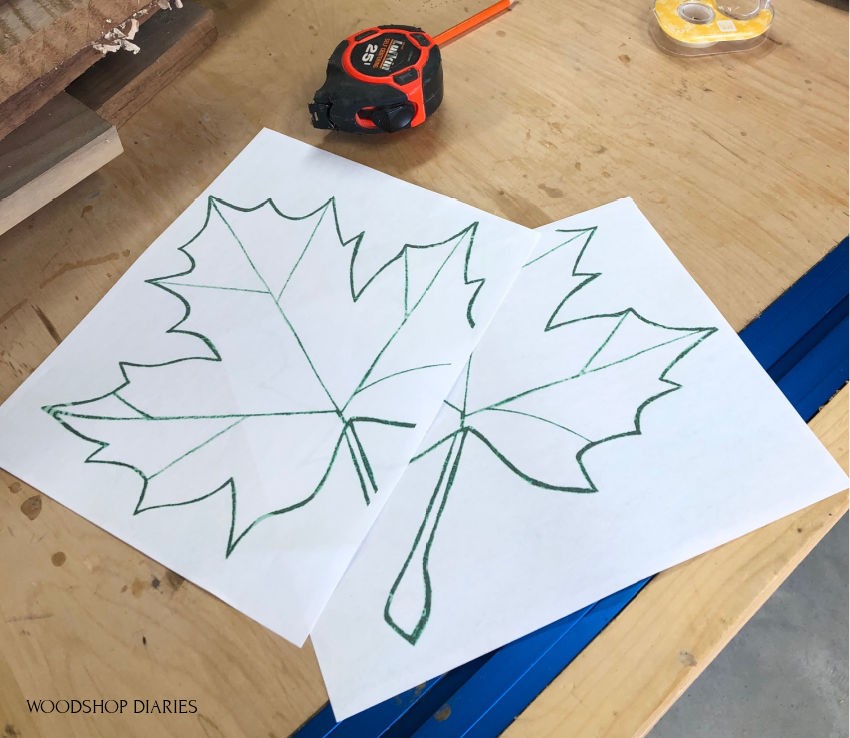 Drawing out leaf shape on paper for DIY fall project leaf tray.