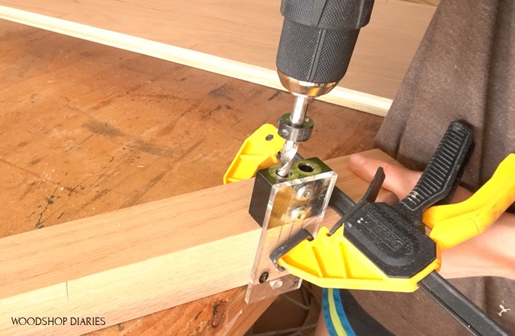 Dowel jig clamped to corner desk post to drill dowel holes for assembly