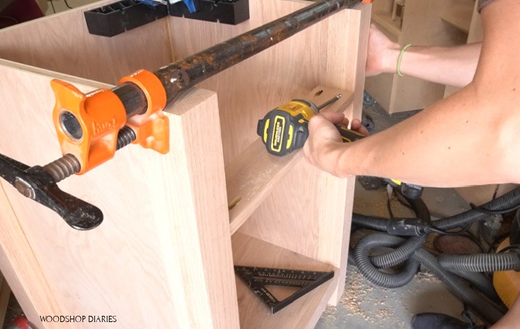 Installing drawer divider into desk cabinet