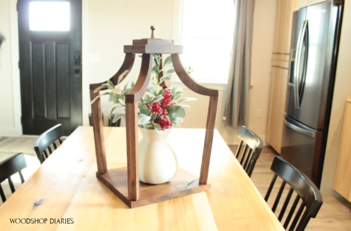 DIY wooden lantern on kitchen table top staged as centerpiece