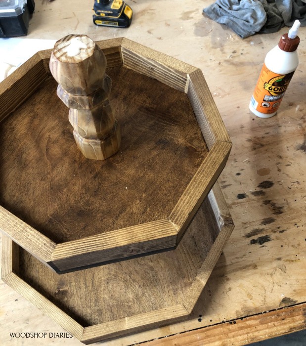 second tier added to bottom tier of 3 tier wooden tray assembly