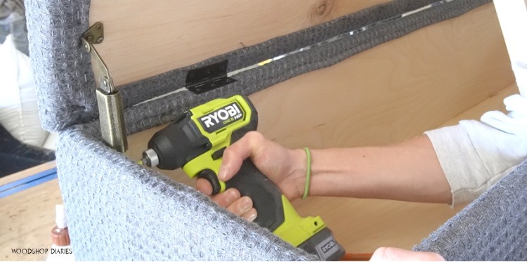 Install chest lid supports into storage bench