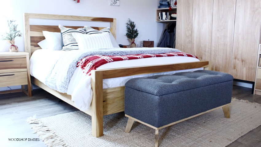 Modern DIY upholstered storage bench at end of bed