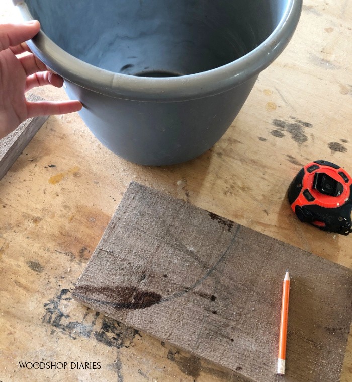 Used water bucket to trace radius onto board