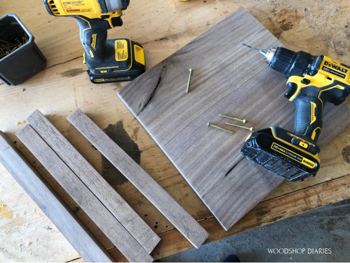 Corner posts and base plate ready to assemble with screws