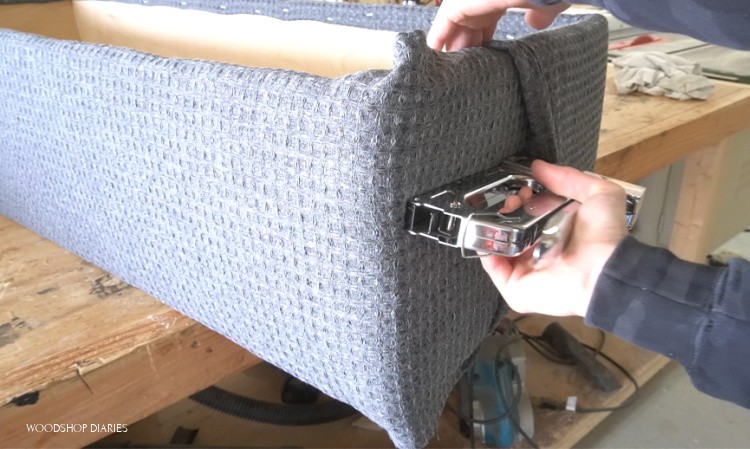 Stapling fabric overlap to hide seams