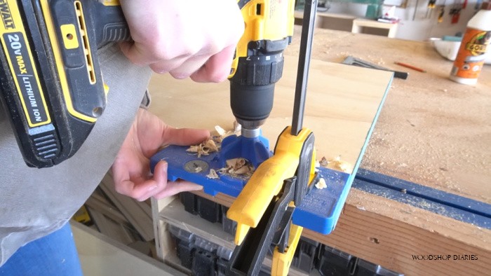 Using concealed hinge jig to drill hinge cup holes