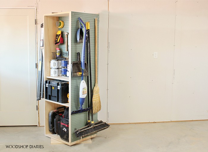 Pegboard on the side of DIY garage storage cabinet