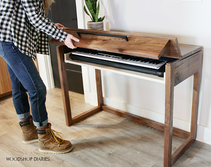 Shara Woodshop Diaries lifting flip up top on DIY walnut keyboard stand