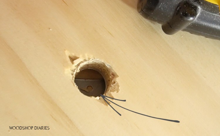 Access holes on base plate of lazy susan cabinet