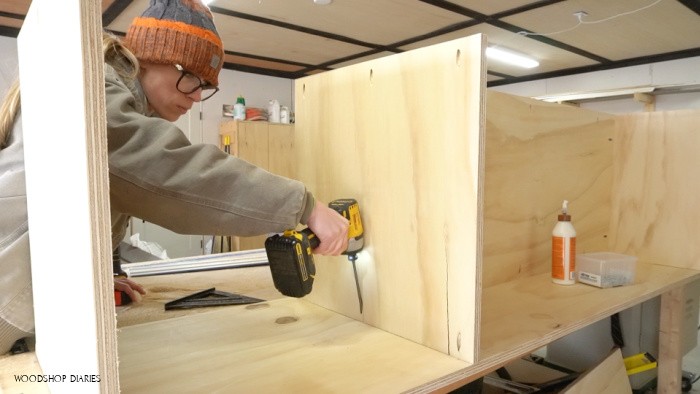 Pocket holes used to assemble middle shelf into cabinet