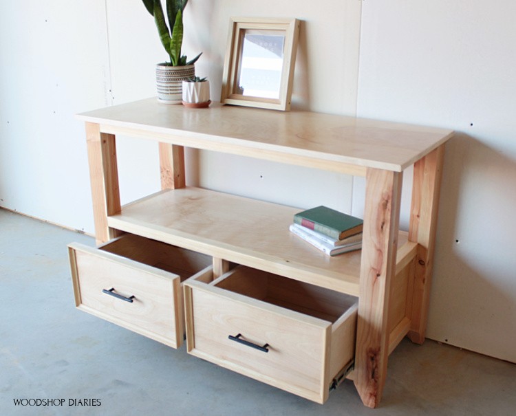 Console table shelf with drawers staged for photos with drawers open to show storage inside