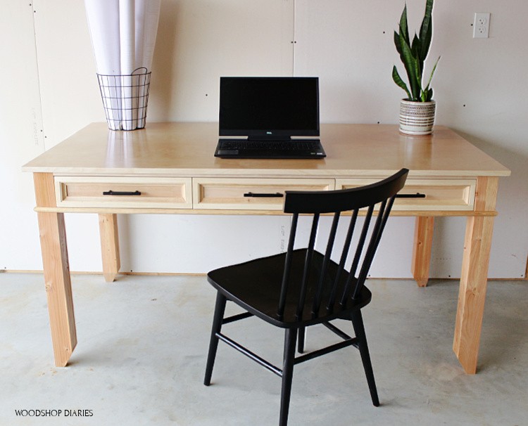 Front view of simple writing desk made from plywood and 2x4s