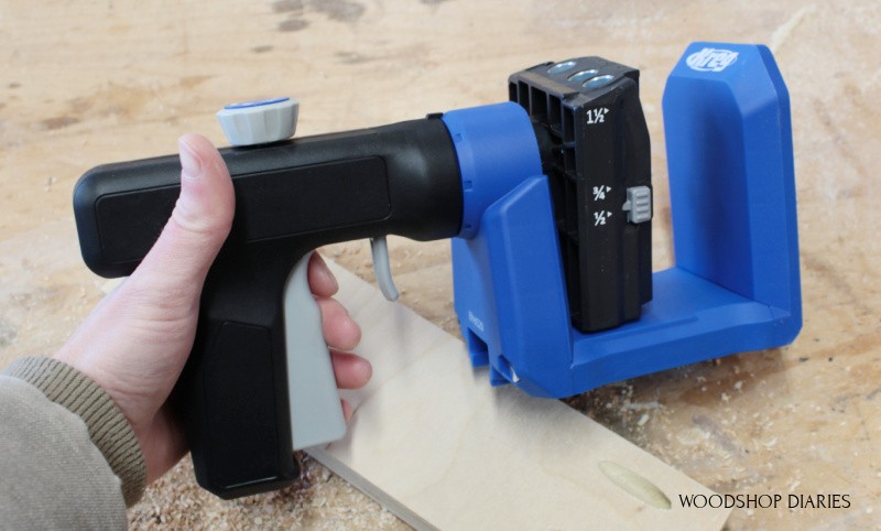 Shara Woodshop Diaries holding the Kreg 520 pocket hole jig