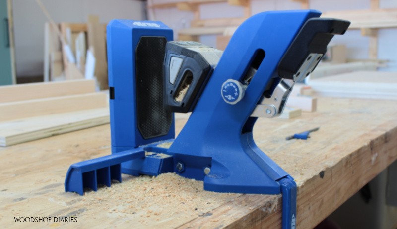 Side view of Kreg 720 pocket hole jig clamped to workbench