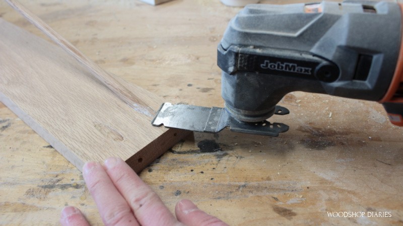 Flush cut blade on oscillating saw cutting dowel rod flush