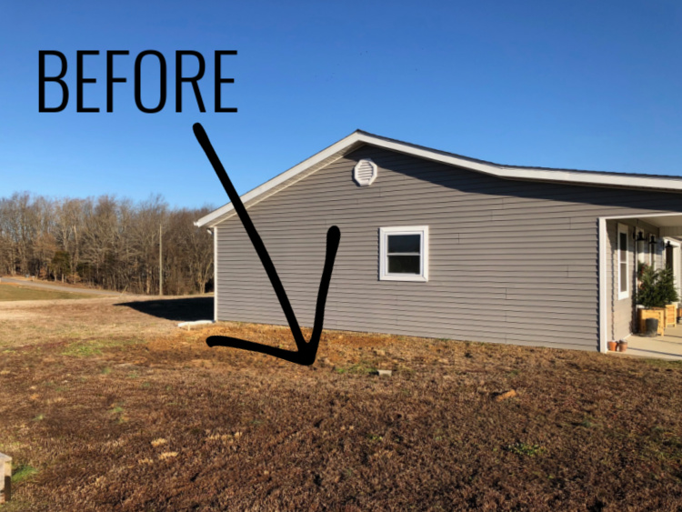 backyard before the makeover--empty spot with no grass