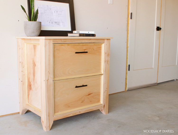 DIY file cabinet built from plywood and 2x4s with clear natural finish and modern black handles