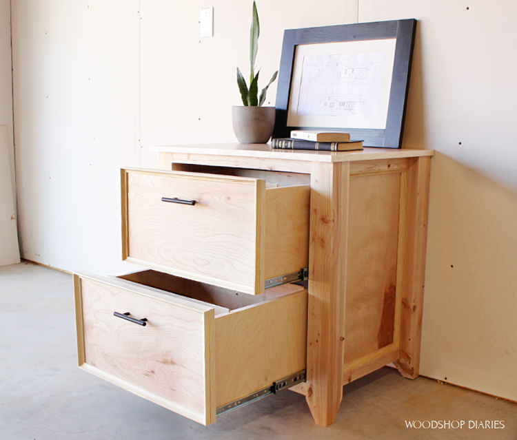 DIY file cabinet made from plywood and 2x4s with drawers open