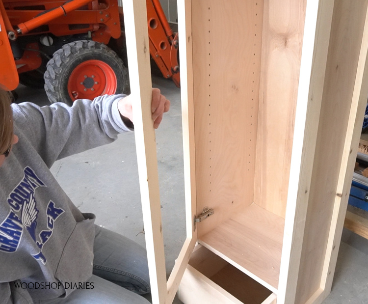 Installing door into pantry cabinet