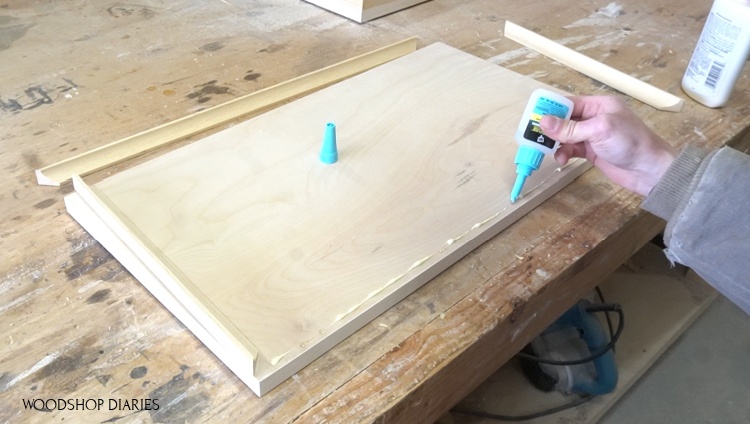 Applying RapidFuse glue between wood glue on drawer front