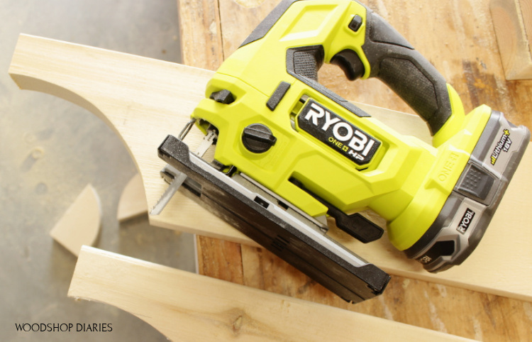 Close up of Ryobi HP jig saw used to cut curves on 2x6 boards for cart handle