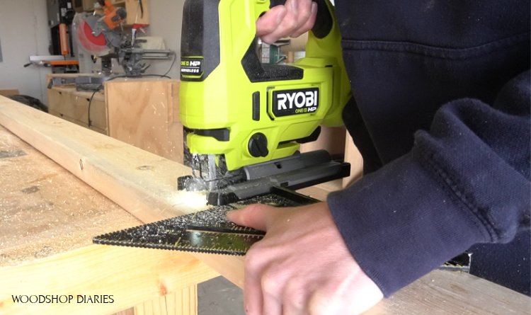 Using a jig saw and a square to cut pieces for grill cart frame