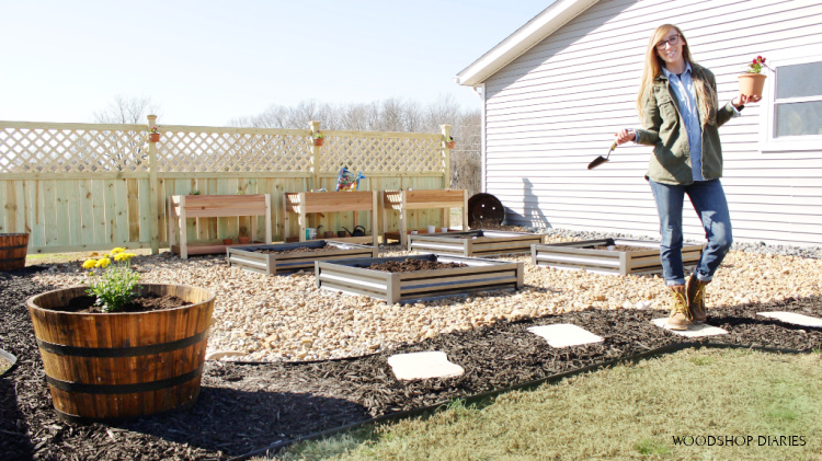 Shara Woodshop Diaries in new garden with privacy fence in back