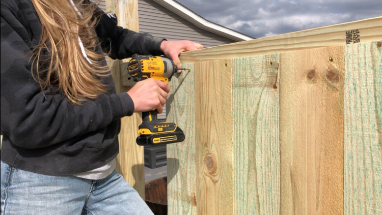 Screwing fence pickets into privacy fence frame